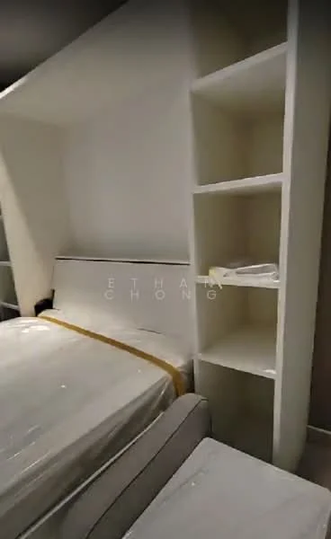 Bedroom features: queen-size bed, upholstered headboard, built-in wardrobe, white painted walls, light-colored bedding, shelving unit, flooring not visible, decorative items on shelves; style: modern.
