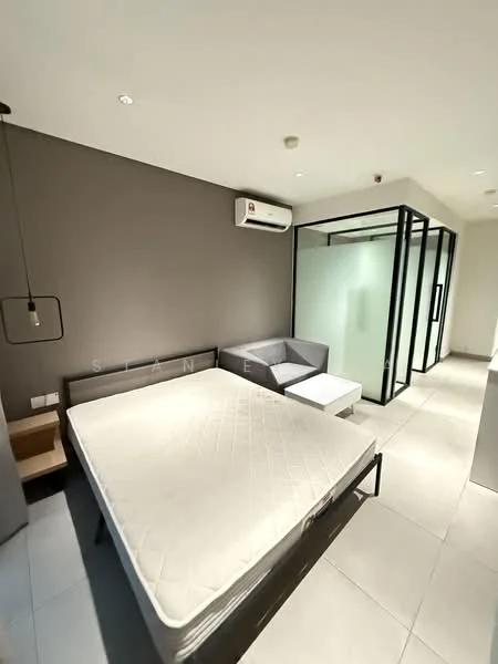 Bedroom features: queen-size bed frame without mattress, grey upholstered headboard, 1 bedside table, wall-mounted air conditioning unit, floor-to-ceiling glass partition, grey fabric sofa, white coffee table, light grey tiled flooring, recessed downlights, neutral painted walls; style: modern.