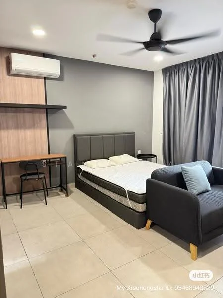 Bedroom features: queen-size bed, upholstered headboard, grey accent wall, light grey walls, floor-to-ceiling window with curtains, ceiling fan, air conditioning unit, wooden desk, black metal chair, sofa in dark grey, tile flooring; style: modern.