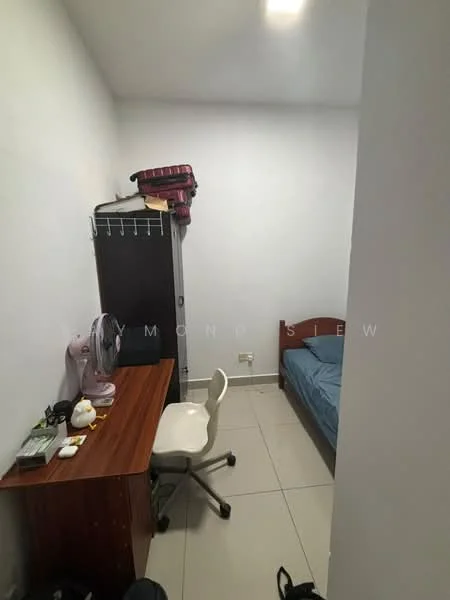 Bedroom features: white painted walls, tile flooring, single bed with blue bedding, wooden desk, office chair, table fan, clothes rack, stack of blankets, window with no visible treatment.