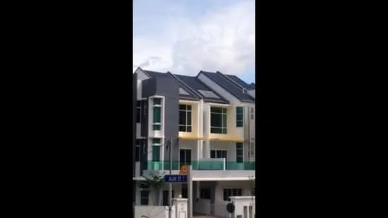 Exterior type: linked terrace house; features: two-storey building, grey and yellow painted facade, flat roof, balconies with glass railings, large windows, solar panels on roof, manicured front garden, driveway, street signage, surrounded by greenery; style: modern.