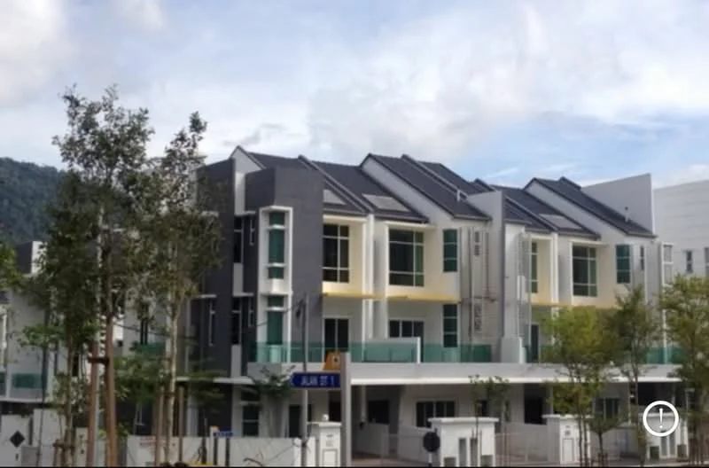 Exterior type: linked terrace house; features: modern facade with a mix of materials, glass balcony railings, gabled roof with tiles, large windows with white frames, green landscaping with young trees, two-storey structure, driveway with interlocking pavers, front porch area, surrounded by greenery, visible street signage; style: modern.