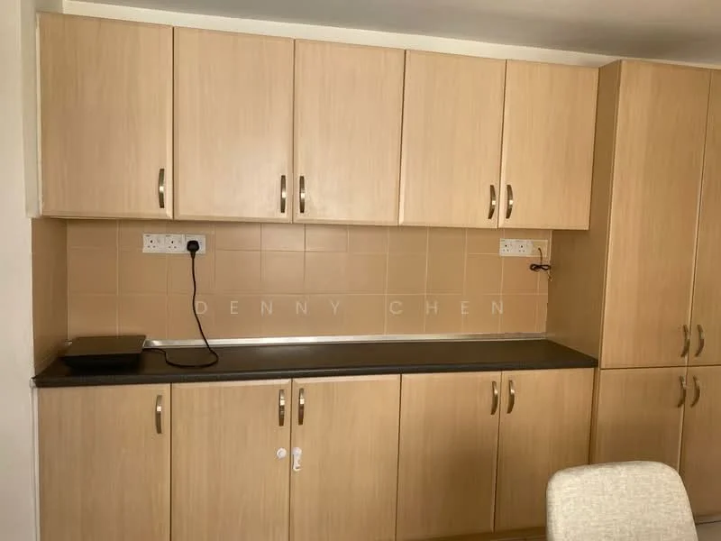 Kitchen features: light wood cabinetry, black countertop, beige tiled backsplash, wall-mounted electrical outlets, single-basin sink, stainless-steel faucet, under-cabinet lighting, drawer handles, cabinets with multiple doors; style: modern.
