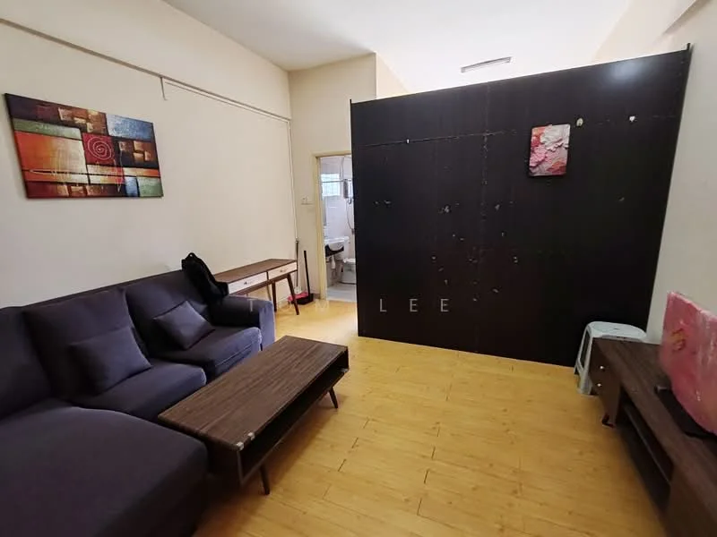 Living features: 3-seater fabric sofa in dark purple, wood coffee table, wood side table, framed abstract artwork on wall, laminate flooring, light-colored walls, partition wall, TV console, floor lamp, natural light from window; style: modern. Room features: visible bathroom door, unknown wall color, unknown flooring.