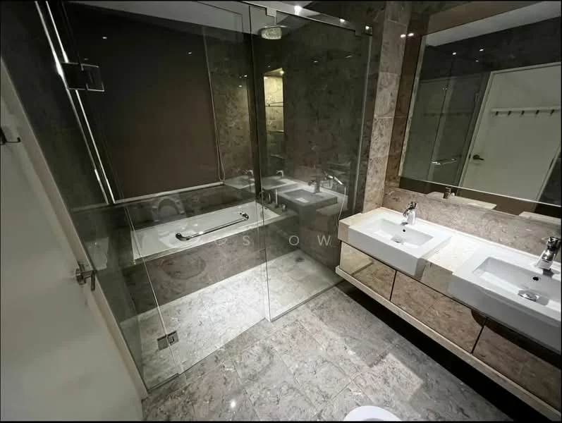 Bathroom features: double-sink vanity with stone countertop, two square vessel sinks, chrome basin mixers, framed mirrors above sinks, walk-in shower with glass enclosure, rain shower head, bathtub, marble tile flooring, grey accent wall, recessed downlights, wall-mounted towel rack; style: modern.