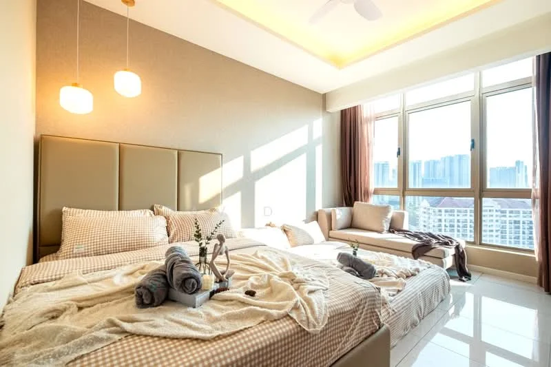 Bedroom features: king-size bed with upholstered headboard, twin beds with checkered bedding, floor-to-ceiling windows, sheer curtains, brown accent wall, recessed ceiling lights, ceiling fan, white tiled flooring, decorative throw pillows, bedside table with decorative items, plush area rug, lounge chair by the window; style: modern; view: city.