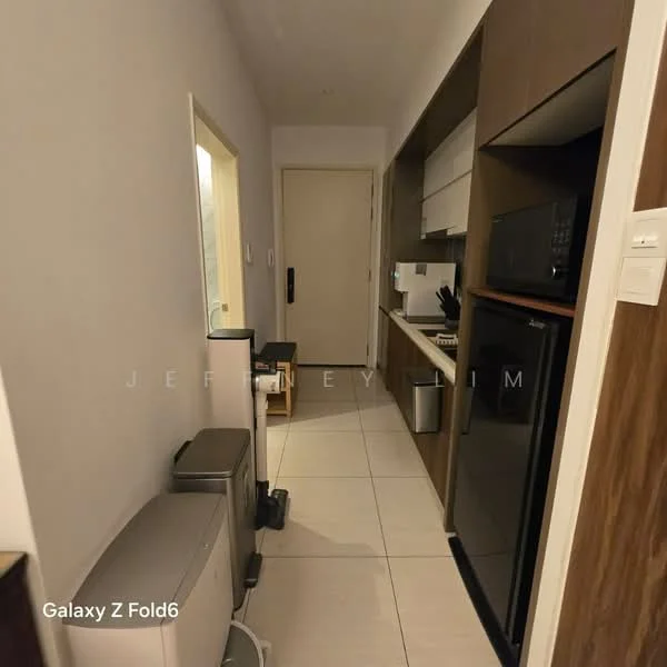 Room features: white painted walls, tile flooring, built-in cabinetry, countertop, microwave, black refrigerator, kitchen sink, kitchen appliances, door, light fixture; style: modern.