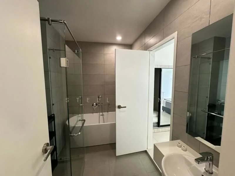 Bathroom features: bathtub with glass shower enclosure, chrome wall-mounted faucet, single-sink vanity with white cabinet, framed mirror, grey tile walls, grey tile flooring, recessed downlights, sliding glass door, toilet, towel rack; style: modern.