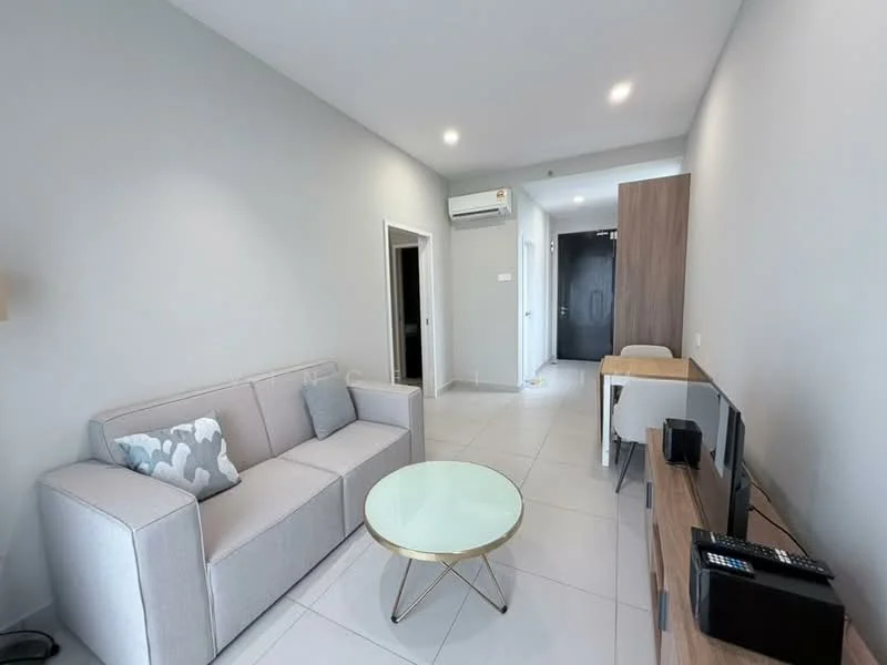 Living features: light grey painted walls, white tiled flooring, sofa in light grey fabric, decorative cushions, glass coffee table with gold base, wall-mounted TV, TV console in wood finish, air conditioning unit on wall, recessed ceiling lights; style: modern. Room features: doorway leading to hallway, doorway leading to another room.