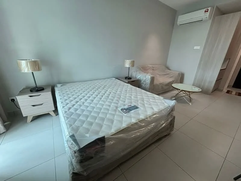 Bedroom features: queen-size bed with protective plastic cover, 2 bedside lamps with fabric shades, light grey painted walls, white tiled flooring, wall-mounted split AC unit, sofa covered in protective plastic, small round coffee table, built-in wardrobe, window with no visible treatment; style: modern.
