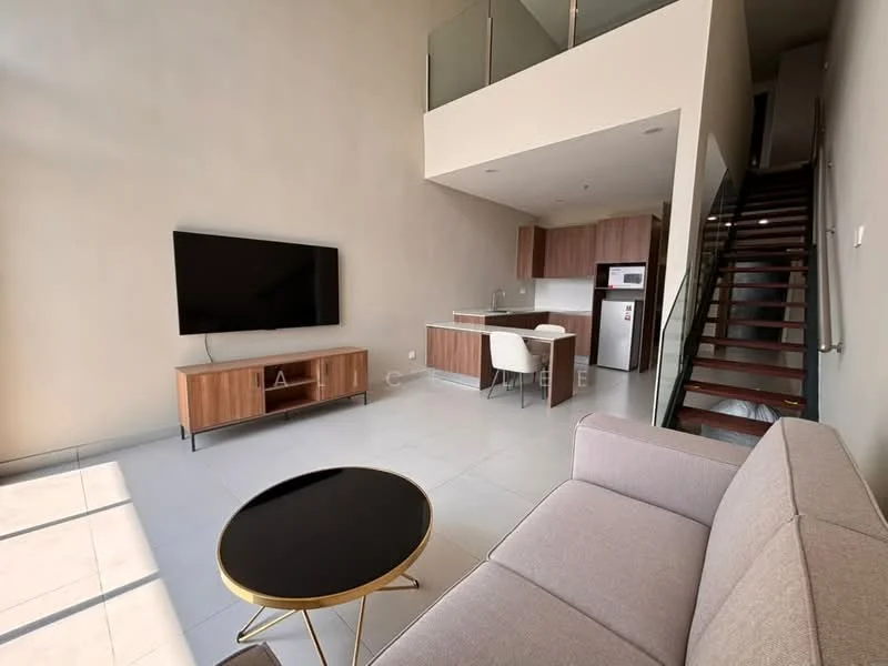 Living features: light grey fabric sofa, black round coffee table, wall-mounted flat-screen TV, wooden TV console, white walls, large windows allowing natural light, ceramic tile flooring, open-plan layout leading to kitchen, staircase with wooden steps and metal railing; style: modern. Kitchen features: kitchen island, stainless-steel fridge, built-in oven, freestanding range oven, white cabinetry, grey countertop, ceramic tile flooring; style: modern.