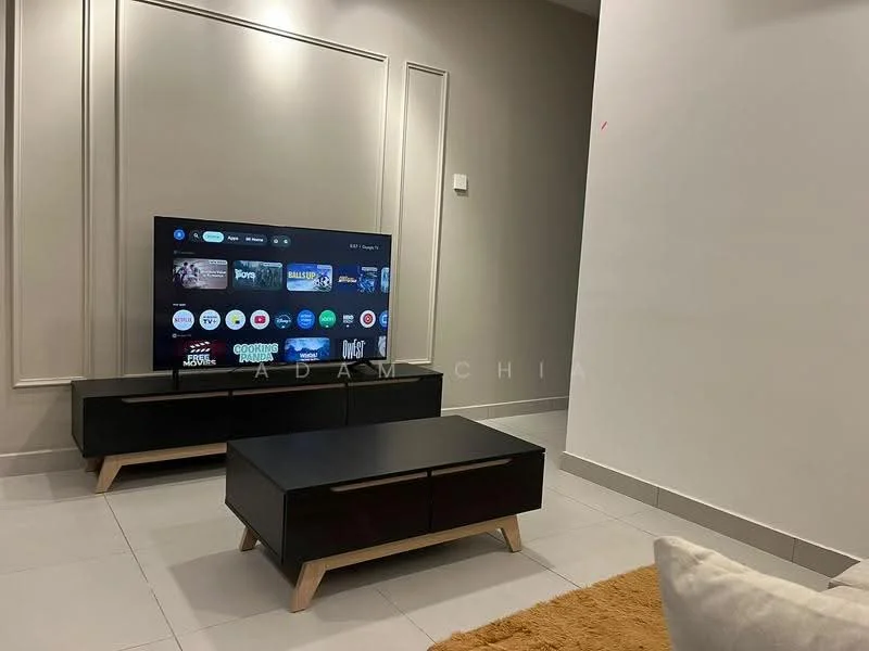 Living features: wall-mounted TV, black TV console with wooden legs, coffee table with wooden legs, light grey walls, white accent wall with paneling, grey floor tiles, beige area rug, cushion on sofa; style: modern.