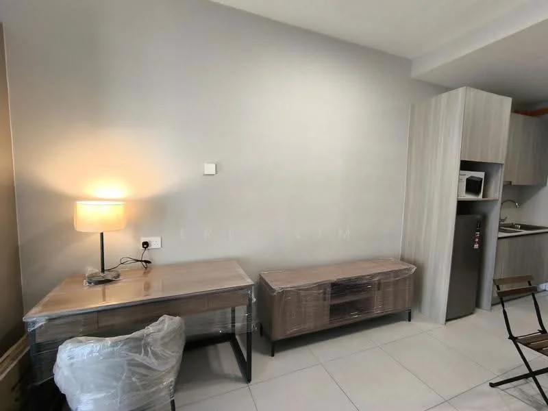 Room features: light-colored walls, laminate flooring, wooden side table, table lamp, wooden TV console, microwave, fridge, kitchenette, plastic wrap on furniture; style: modern.