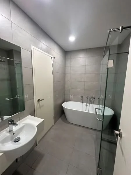 Bathroom features: freestanding bathtub, glass shower enclosure, single-sink vanity with white cabinet, chrome basin mixer faucet, large wall mirror, grey tiled walls, grey tile flooring, recessed ceiling lights; style: modern.