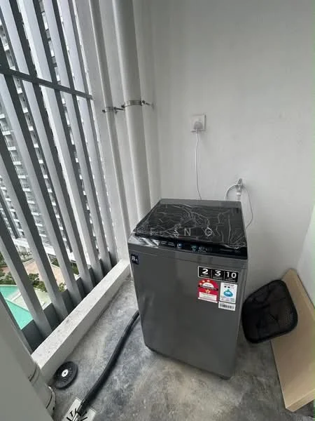 Laundry features: top-load washing machine in grey, black lid, water inlet hose, drainage hose, white wall, grey floor, balcony with railing.