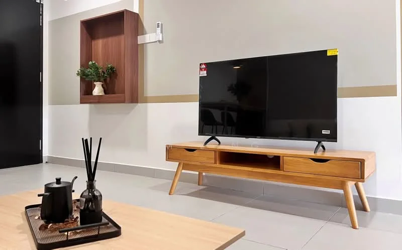 Living features: wooden TV console with drawers, black flat-screen TV, light grey wall, dark door, white tiled flooring, decorative wall shelf, green plant in ceramic pot, coffee table, decorative tray with teapot and sticks; style: modern.