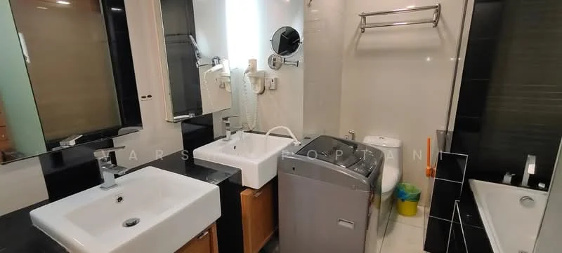 Bathroom features: double-sink vanity with wood cabinet, chrome basin mixer faucet, framed mirror, one-piece toilet, built-in washing machine, bathtub, tile cladding, black accent wall, white tiled walls, wooden cabinetry, shelving unit, green trash bin; style: modern.