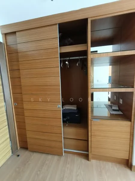 Room features: wooden sliding wardrobe doors, built-in shelving, hanging space for clothes, drawer storage, laminate wood finish, light-colored wooden flooring; style: modern.
