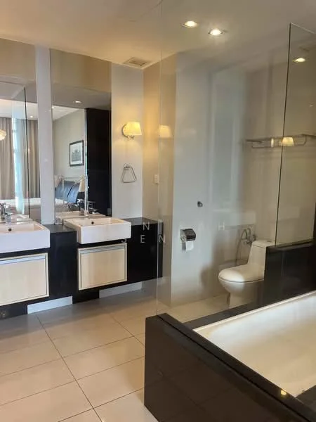 Bathroom features: double-sink vanity with wood cabinet, chrome basin mixer faucets, framed mirror above sinks, built-in bathtub, glass shower enclosure, one-piece toilet, tile flooring, recessed downlights, wall-mounted towel rack; style: modern.