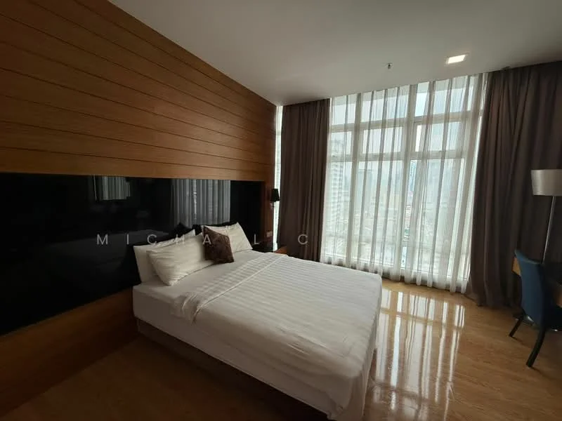 Bedroom features: queen-size bed, white bedding, wood panel accent wall, floor-to-ceiling windows, sheer curtains, wooden flooring, desk with chair, table lamp; style: modern; view: city.