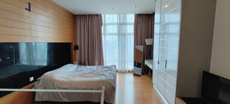 Bedroom features: king-size bed with silver bedding, wooden accent wall, floor-to-ceiling windows, sheer curtains, laminate flooring, white built-in wardrobe with glossy finish, wall-mounted TV, decorative lamp, nightstand with lamp, recessed downlights; style: modern; view: city.