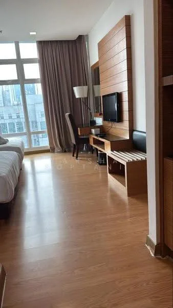 Room features: wooden flooring, large floor-to-ceiling windows, curtains, wall-mounted TV, wooden feature wall, side table, lamp, built-in shelving, seating area, decorative paneling; style: modern; view: city.