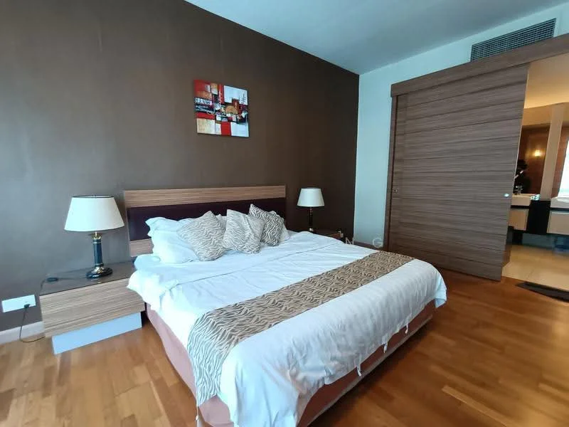 Bedroom features: king-size bed with white bedding, upholstered headboard, wooden bedside tables, table lamps with cream shades, wooden flooring, brown accent wall, decorative artwork on wall, sliding wardrobe door, natural light from window, neutral color scheme; style: modern.