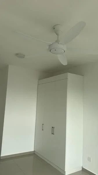 Room features: white painted walls, ceiling fan, built-in wardrobe with white doors, tile flooring, recessed ceiling light.