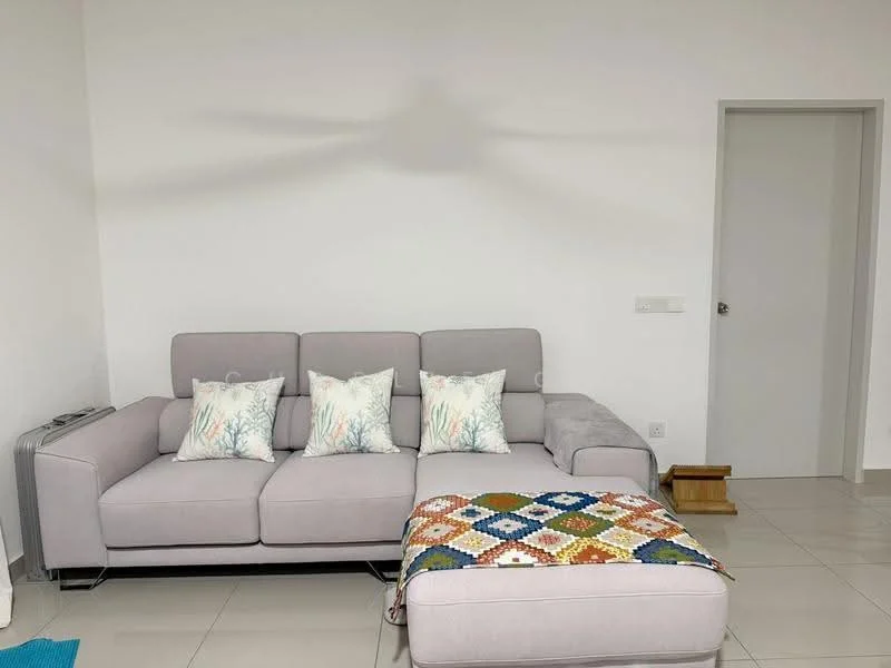 Living features: 3-seater fabric sofa in light grey, decorative throw pillows with tree pattern, ottoman with patterned fabric, white painted walls, tile flooring, ceiling fan, door leading to another room, small wooden step, natural light from window; style: modern.
