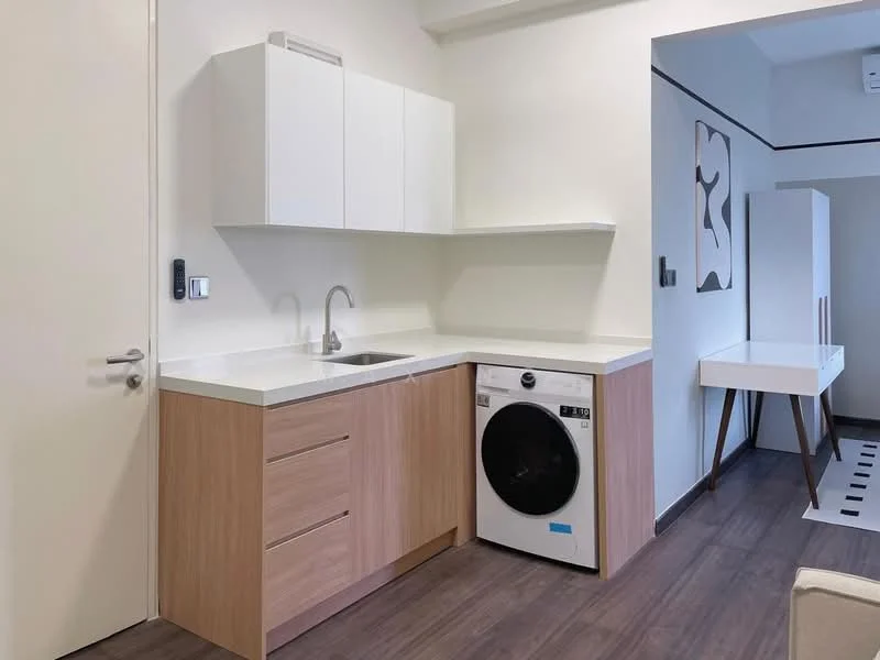 Laundry features: white cabinetry, wooden cabinetry with natural finish, white countertop, single-bowl stainless-steel sink, washing machine, vinyl plank flooring, wall-mounted shelf, neutral wall color; style: modern.