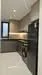Kitchen features: black granite countertop, grey cabinetry, stainless-steel fridge, built-in oven, 4-burner gas hob, black backsplash, single-bowl stainless-steel sink, chrome pull-down faucet, recessed downlights, floor-to-ceiling window, tile flooring, washing machine, open shelving; style: modern; view: city.