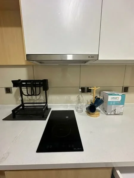 Kitchen features: black induction cooktop, stainless-steel range hood, white quartz countertop, light wood cabinetry, glass bottle, blue kettle, black utensil holder, wooden kitchen tool holder; style: modern.