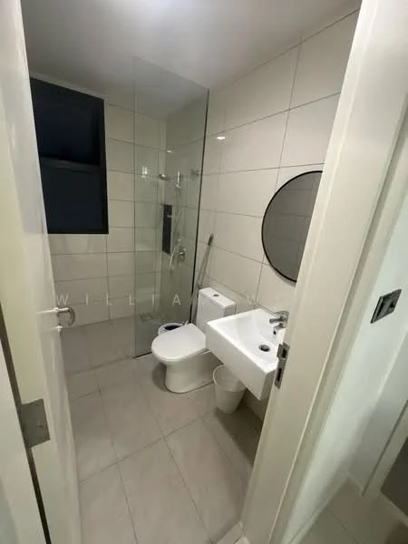 Bathroom features: white tiled walls, light grey tiled flooring, walk-in shower with glass enclosure, chrome shower head, chrome basin mixer faucet, round mirror, one-piece toilet, toilet paper holder, waste bin; style: modern.