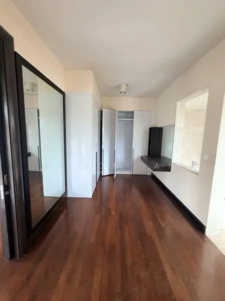 Bedroom features: wooden flooring, large floor-to-ceiling mirror, built-in wardrobe with sliding doors, white painted walls, recessed ceiling lights, window with natural light, black cabinetry, open space layout; style: modern.