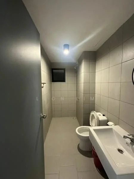 Bathroom features: grey tiled walls, light grey tiled flooring, single-sink vanity with white cabinet, chrome basin mixer faucet, one-piece toilet, small window, ceiling light fixture, mirror above sink; style: modern.