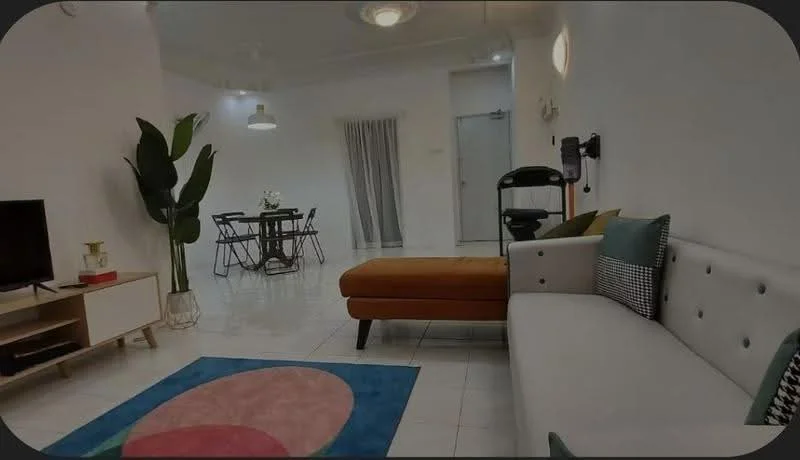Living features: L-shape sectional sofa in grey, orange ottoman, round area rug with geometric pattern, wall-mounted TV, TV console, ceiling fan with light, decorative wall art, potted plant, floor-to-ceiling curtains, dining table with chairs visible in background; style: modern.