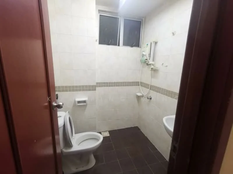 Bathroom features: white ceramic toilet, wall-mounted bidet, shower with handheld showerhead, tile flooring in dark color, light-colored wall tiles, window for natural light, grab bar, toilet paper holder.