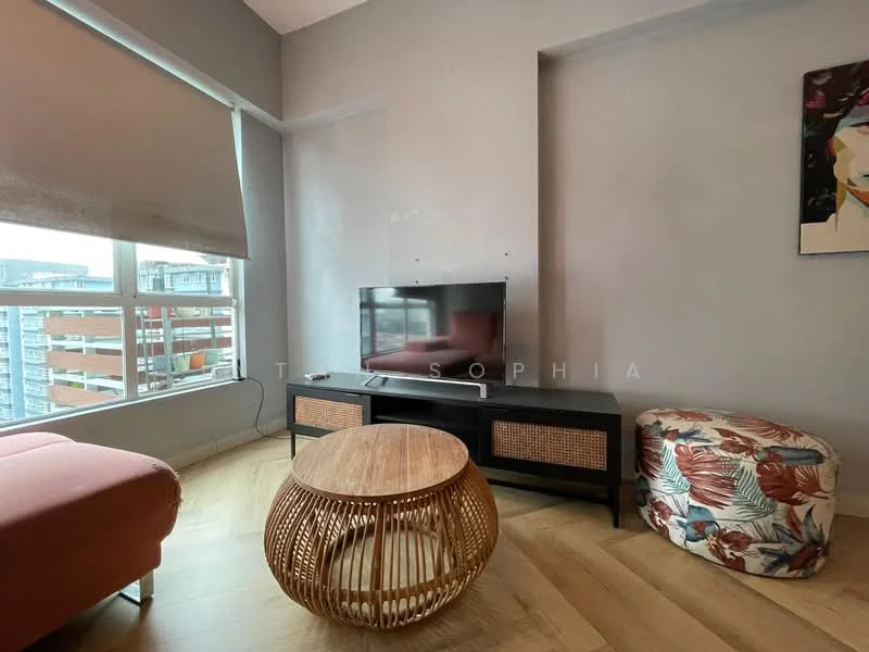Living features: light grey painted walls, wooden flooring, floor-to-ceiling windows, roller blinds, wall-mounted TV, black TV console with rattan details, round wooden coffee table, upholstered ottoman with floral pattern, sofa in coral color, decorative artwork on wall; style: modern; view: city.