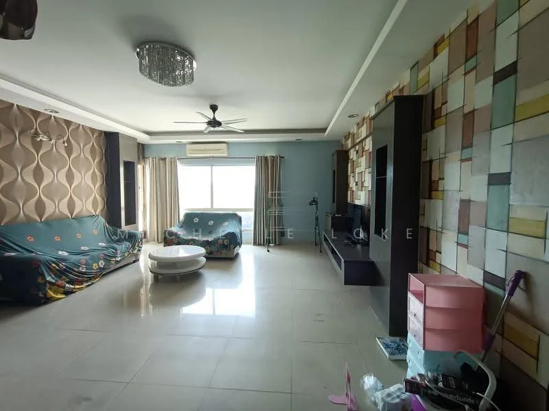 Living features: cream painted walls, feature wall with geometric pattern, large window with sheer curtains, 2 ceiling fans, chandelier, polished tile flooring, sofa covered with fabric, round coffee table, TV console, wall-mounted TV, decorative storage unit, area rug; style: modern; view: city.
