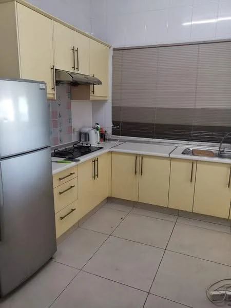 Kitchen features: yellow cabinetry, stainless-steel fridge, built-in gas stove, white countertop, tile backsplash, double-bowl stainless-steel sink, window with blinds, ceramic tile flooring, wall-mounted range hood, kettle, dish soap dispenser, cleaning supplies, cutting board; style: modern.