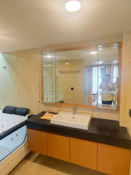Bathroom features: single-sink vanity with wood cabinet, white rectangular sink, chrome basin mixer faucet, large wall-mounted mirror, black countertop, cream tiled walls, light-colored flooring, bathtub with jets, towel rack, glass shower enclosure; style: modern.