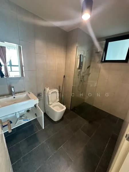 Bathroom features: grey tiled walls, dark grey floor tiles, single-sink vanity with chrome faucet, framed mirror above sink, one-piece toilet, walk-in shower with glass enclosure, rain shower head, handheld shower, window for natural light, ceiling light fixture; style: modern.
