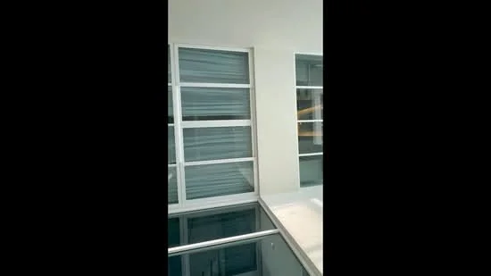 Room features: large windows, sliding glass windows, white walls, grey window frames, glass railing, floor-to-ceiling windows; style: modern.