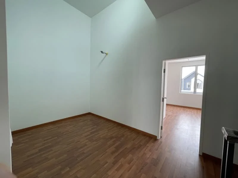 Room features: high ceiling, white painted walls, wooden flooring, single window, doorway leading to another room.