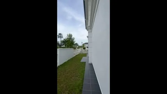 Exterior features: white painted facade, flat roof, manicured lawn, paved walkway, surrounded by greenery; style: modern.