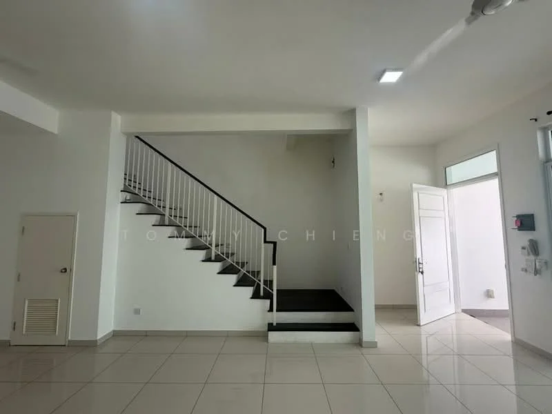 Room features: white painted walls, tile flooring, staircase with black steps and white railing, large windows allowing natural light, main entrance door, door frame with glass panel, air conditioning unit, light fixtures on ceiling; style: modern.