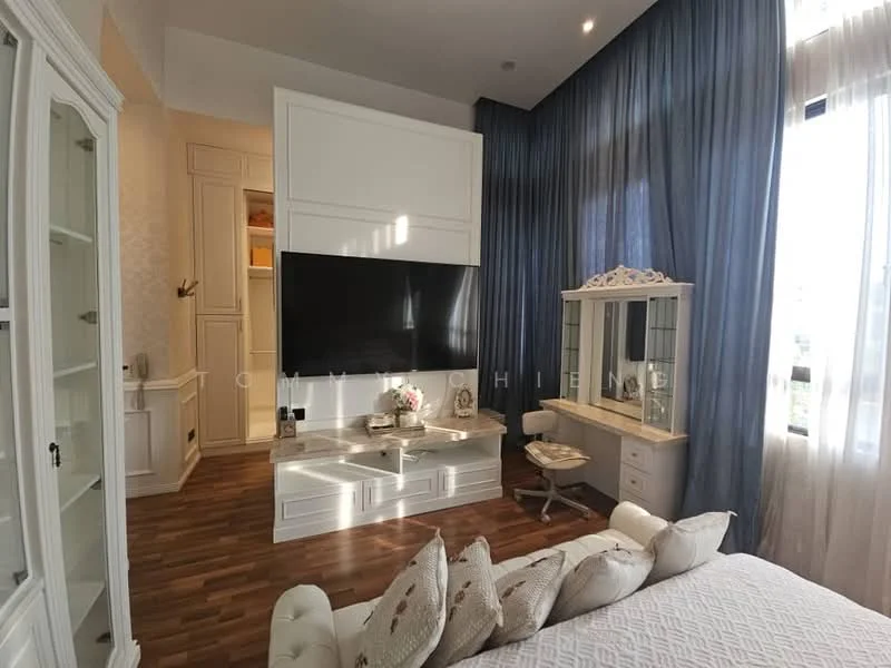 Bedroom features: white upholstered bed, decorative pillows, wooden flooring, large wall-mounted TV, white built-in cabinetry, dressing table with mirror, blue curtains, floor-to-ceiling windows, wall paneling, decorative vase, soft lighting, neutral color palette; style: modern.