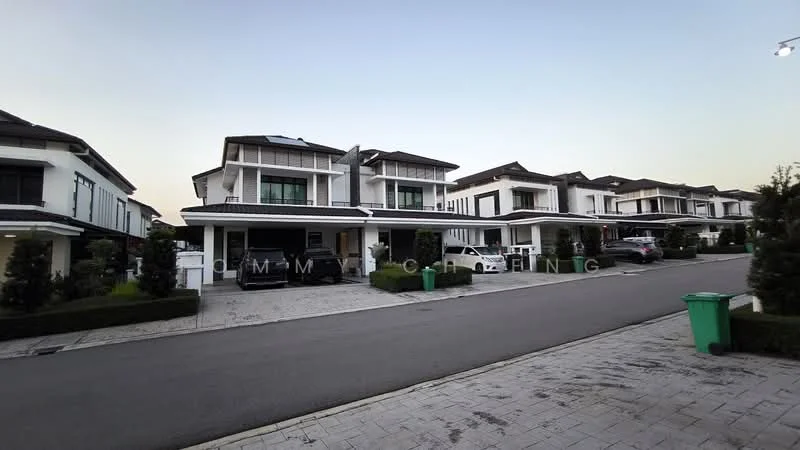 Exterior type: linked terrace house; features: white painted facade, flat roof, two-storey structure, driveway with interlocking pavers, manicured lawn, mature trees, multiple vehicles parked, street view, surrounded by greenery; style: modern.