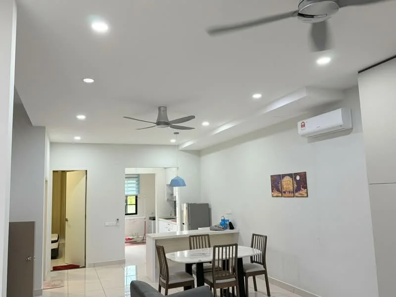 Living features: white painted walls, glossy tile flooring, 5-blade ceiling fan with light, recessed LED downlights, dining table with four chairs, sofa, wall-mounted air conditioning unit, kitchen area visible in background; style: modern.