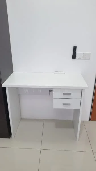Room features: white desk, single drawer, smooth surface, minimalist design, ceramic tile flooring, wall-mounted intercom, plain white walls; style: modern.